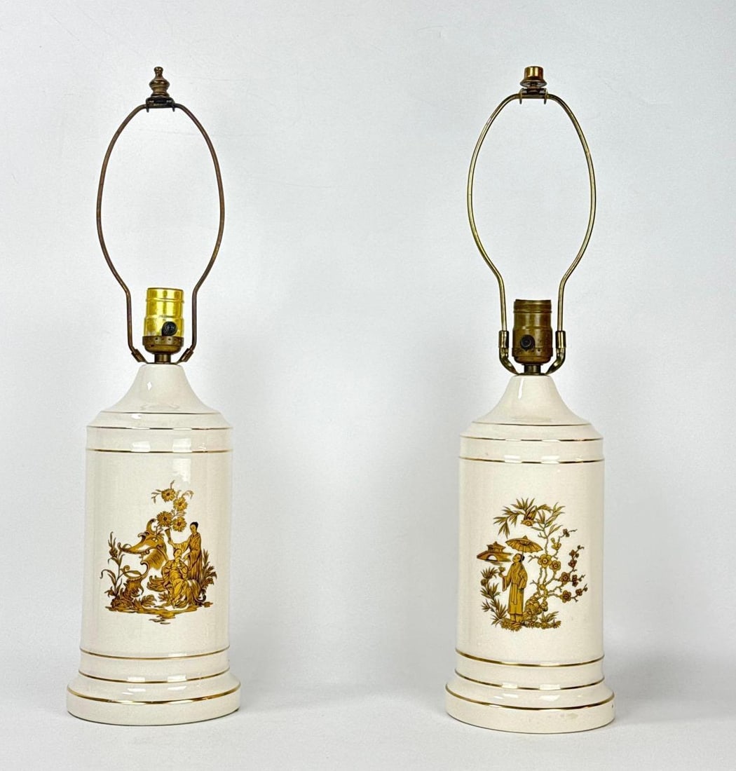 PAIR OF VINTAGE MID-CENTURY CHINOISERIE CERAMIC TABLE LAMPS: Pair of cream-glazed ceramic canister-style table lamps with gold-tone Chinoiserie transfer scenes Approximate Dimensions: 14” tall to top of socket x 5.5”dia Artist or Maker: Unknown P
