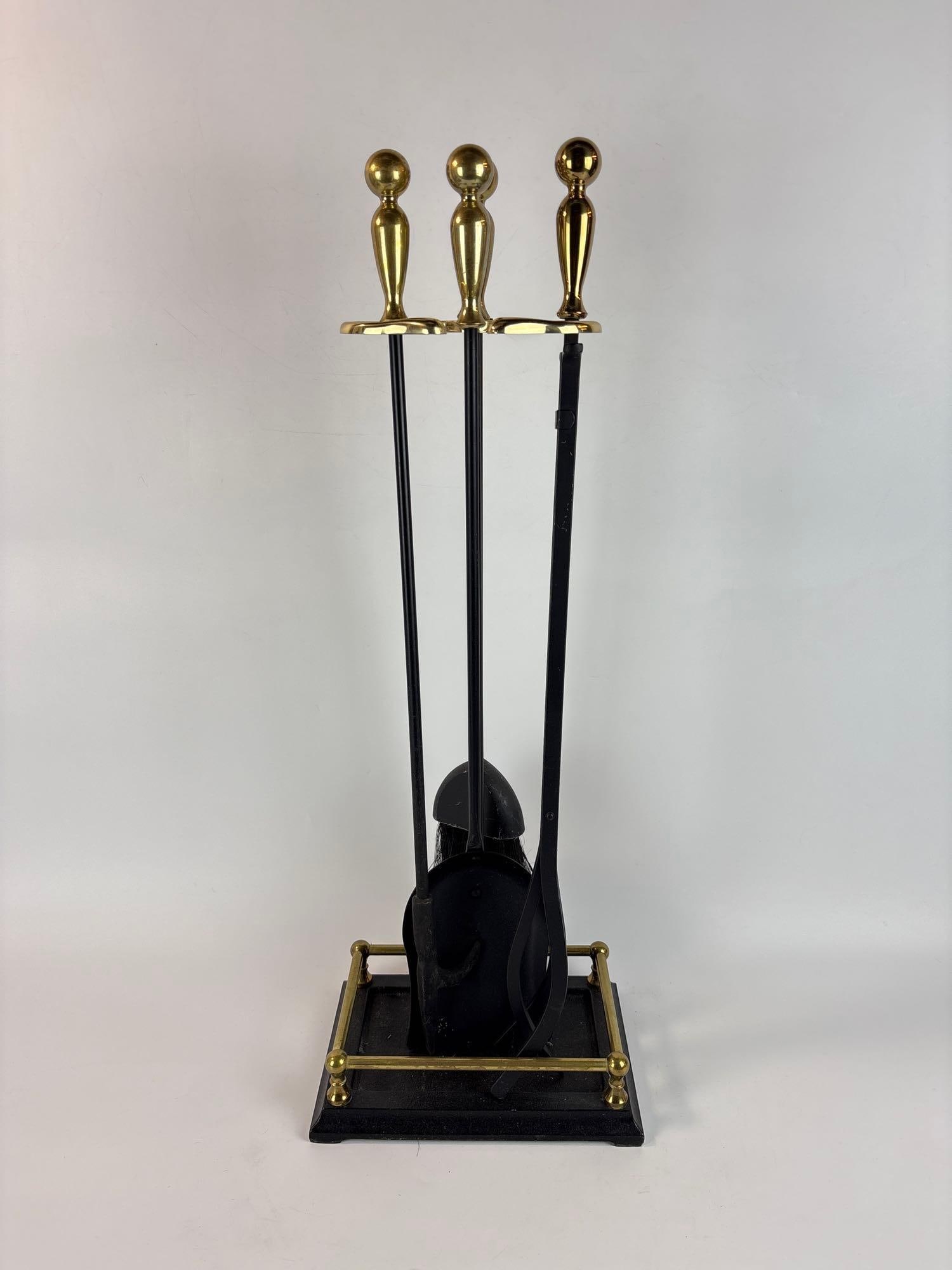 FOUR PIECE BRASS AND BLACK METAL FIREPLACE TOOL SET WITH STAND (1 of 7)