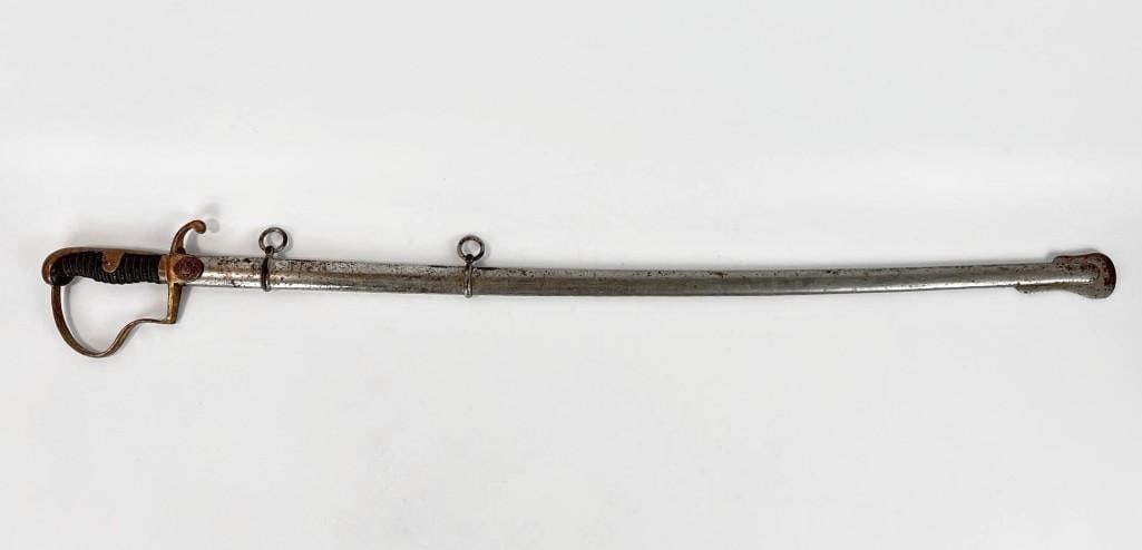 ANTIQUE MILITARY OFFICER SWORD: Curved steel blade military saber with a brass hilt with a distinctive "dove head" or lion head pommel, knuckle guard, and a metal scabbard with a suspension ring. Approximate Dimensions: 38&