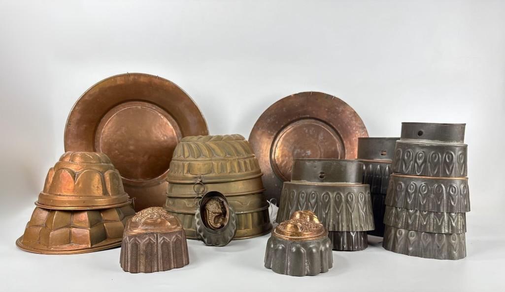 BENHAM & FROUD STYLE AND JONES BROS STYLE ANTIQUE VICTORIAN COPPER JELLY MOULDS AND PLATTERS: Comprehensive lot of 19th-century professional kitchenware including tiered geometric jelly molds and heavy-gauge oval serving platters with tinned interiors. Approximate Dimensions: Largest