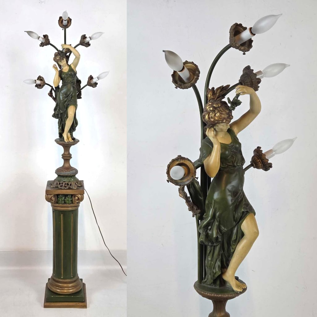 ART NOUVEAU FIGURAL METAL SIX LITE LAMP ON WOOD AND PLASTER PEDESTAL: *Patinated bronze classical maiden statue atop fluted green column base with ornate gilded accents and five-arm floral candelabra. Approximate Dimensions: 63"h Artist or Maker: Unknown Provenance: