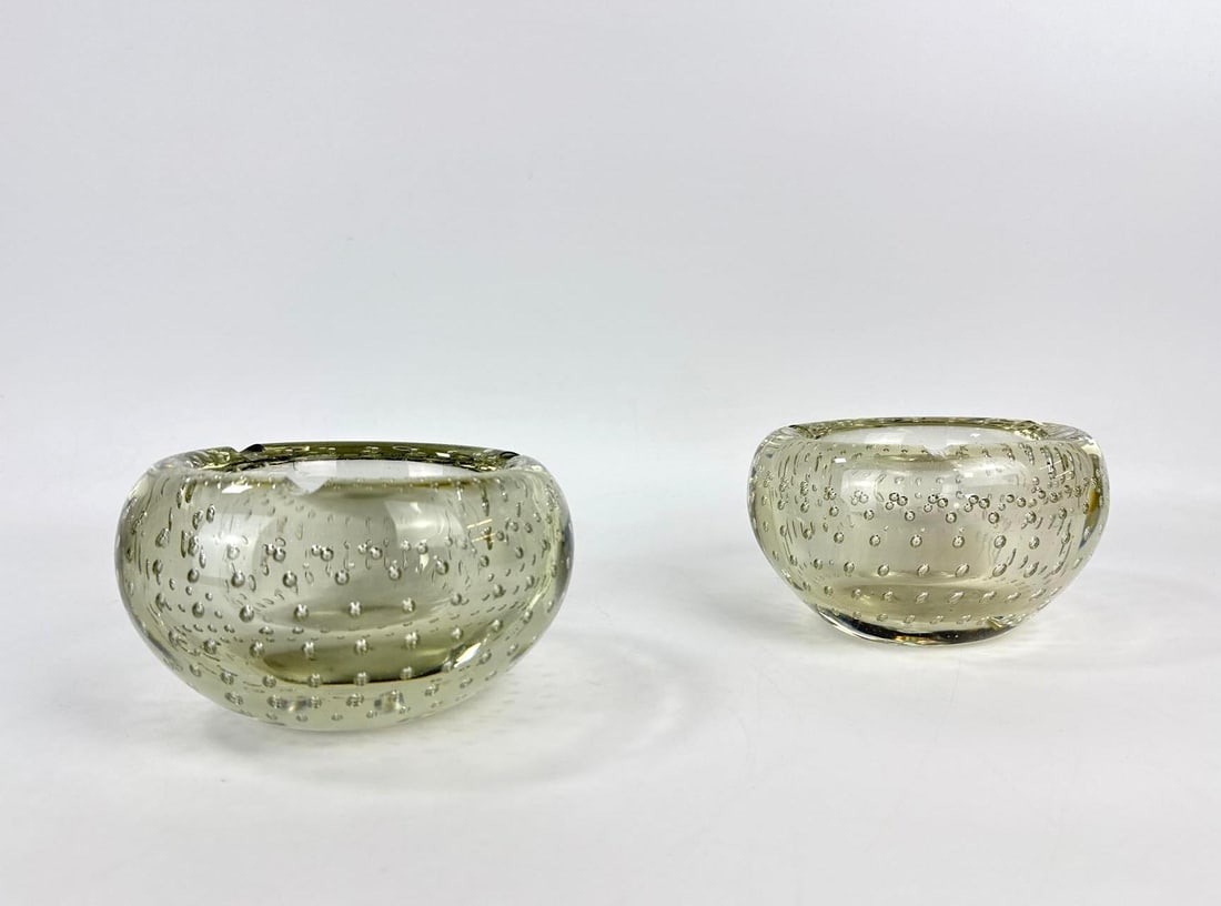 PAIR OF MASSIVE VINTAGE MURANO BULLICANTE ART GLASS VIDE POCHES / BOWLS: *Two heavy hand-blown clear glass circular basins with controlled bubble inclusions. Approximate Dimensions: 3.5”h x 6.5” dia Artist or Maker: Unknown Provenance: From a N