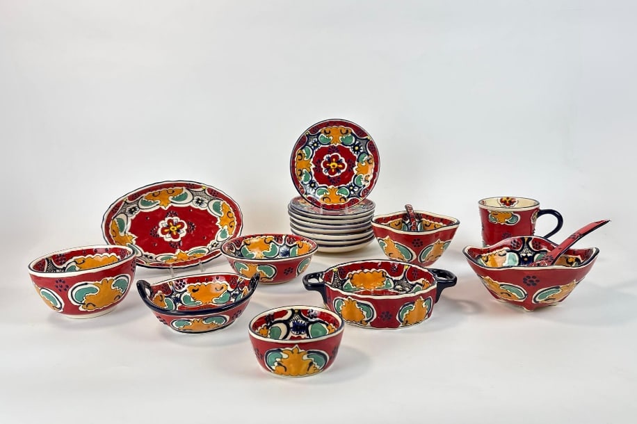 COLLECTION OF HAND PAINTED TIERRA FINA MEXICAN TALAVERA POTTERY: *19pc Vibrant assorted multi-piece ceramic kitchenware set Approximate Dimensions: largest 4”h Artist or Maker: Unknown Provenance: From a New York Collector <