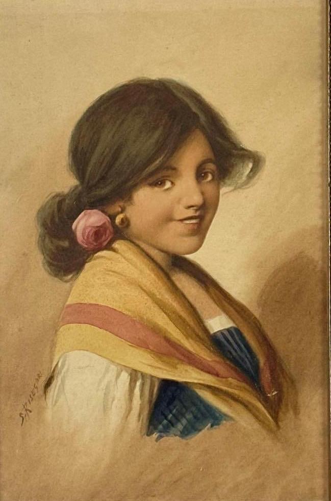SIGNED SILVIA RISEGARI ITALIAN WATERCOLOR PORTRAIT OF A YOUNG GIRL: *Original watercolor on paper depicting a smiling young girl with a pink flower in her hair and a yellow shawl in a heavily carved giltwood frame. Approximate Dimensions: 16.5” X 10.75”; F