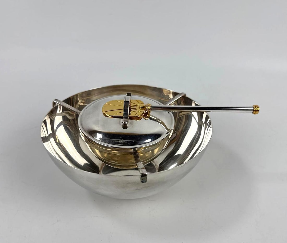 VINTAGE CAVIER SERVING SET - PETROSSIAN SILVER-GILT CAVIAR TASTING SPOON AND E. LIND DENMARK SILVER: Vintage Danish mid-century silver-plated service comprising a lidded chiller bowl with a gold-tone shell finial, a matching underplate. A silver-gilt shell form caviar tasting spoon: "The
