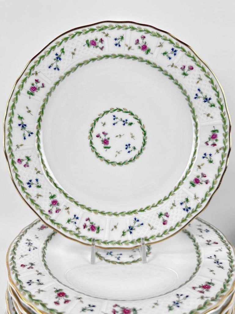 24 BERNARDAUD LIMOGES "ARTOIS VERT" SALAD/DESSERT PLATES: Set of twenty-four French porcelain plates with green laurel borders, floral sprays and gold trim. Approximate Dimensions: 8.5”dia Artist or Maker: Bernardaud & Co (B&C) Limoges