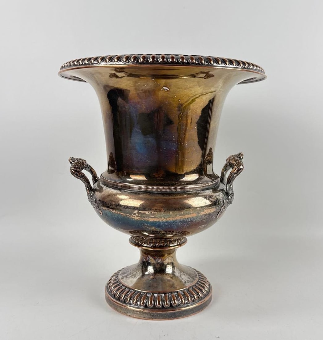 FLORIAN PAPP PROVENANCE 20TH CENTURY NEOCLASSICAL SILVER PLATE URN: *Polished silver-plated neoclassical urn featuring traditional ovoid body and decorative high-loop handles Approximate Dimensions: 11”h x 9.25”dia Artist or Maker: Unknown Provenance: