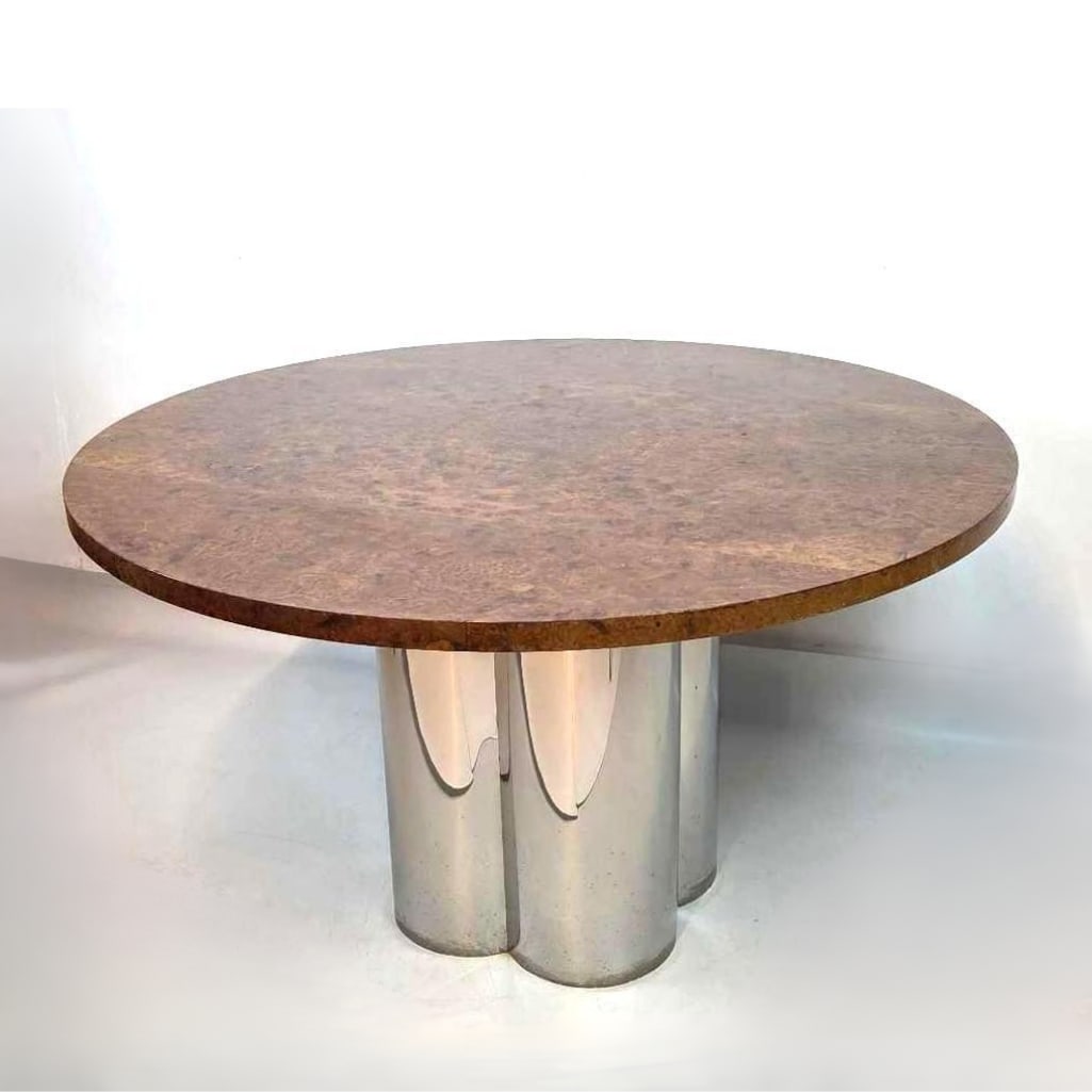 MID CENTURY CHROME AND BURLED WOOD CIRCULAR DINING/CENTER TABLE: A round burl veneer tabletop supported by a polished chrome pedestal base. Approximate Dimensions: 28.25"H x 48"Dia Artist or Maker: Unknown Provenance: From a New York Collector Notes: