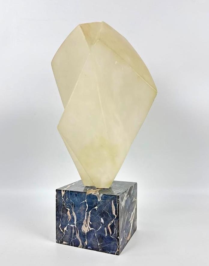 SIGNED MID-CENTURY MODERNIST ABSTRACT ALABASTER SCULPTURE: Geometric hand-carved alabaster form on a square blue-veined marble plinth. Approximate Dimensions: 17”h x 7”w x 6”d Artist or Maker: Unknown Provenance: From a New