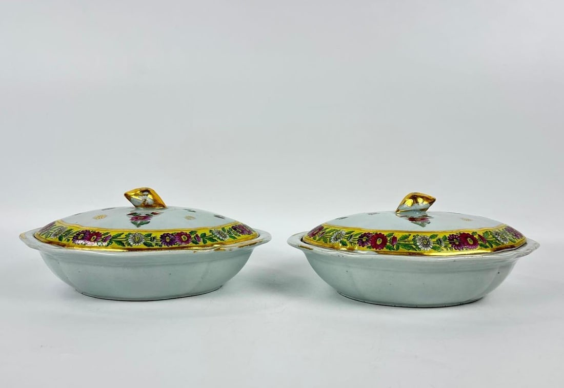 ANTIQUE CHINESE EXPORT PORCELAIN VEGETABLE TUREENS WITH YELLOW FLORAL BORDERS: Pair of 19th-century rectangular vegetable tureens with hand-painted polychrome floral sprays and geometric yellow borders with gilded trim. Approximate Dimensions: 4.75”h x 11”w x 9&rdqu
