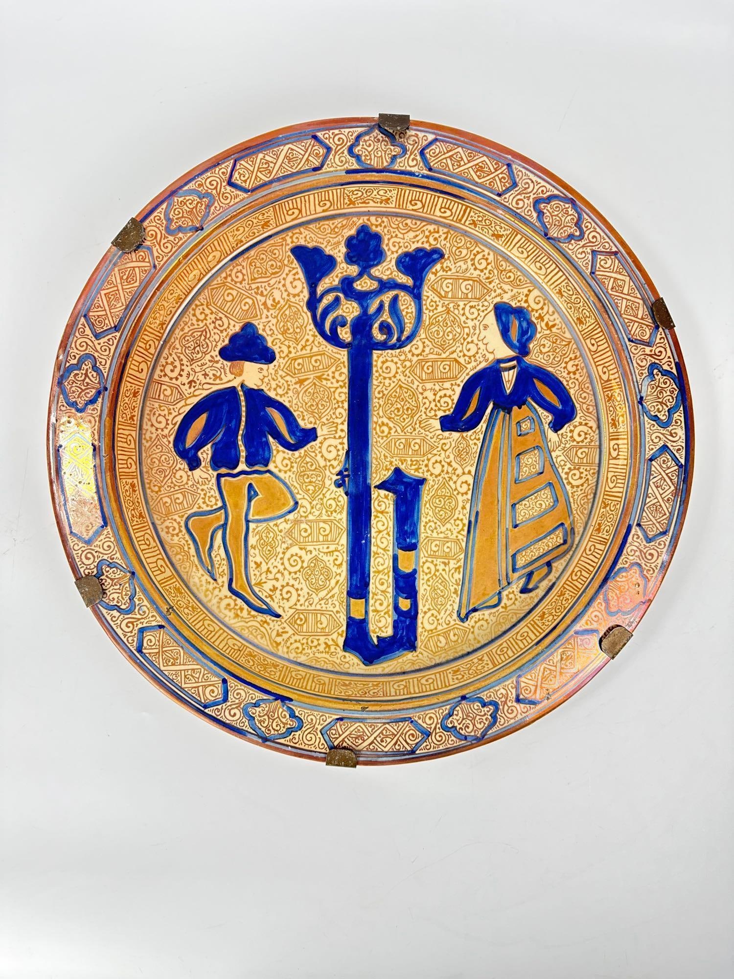 ANTIQUE 19TH CENTURY HISPANO-MORESQUE LUSTREWARE CHARGER: Large hand-painted 19th-century ceramic display platter in the Manises tradition with iridescent metallic copper glaze over a cream ground in complex geometric and botanical motifs. Approximate Dimen