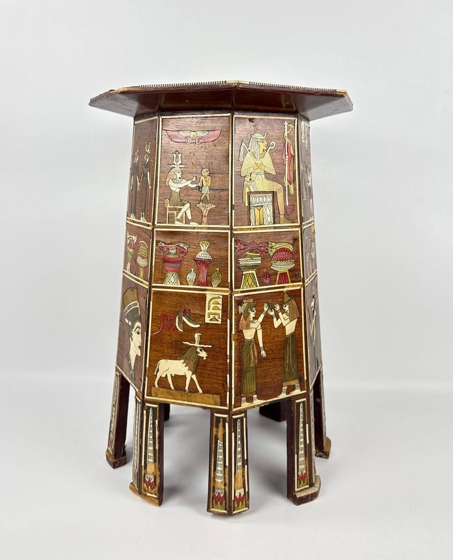 ANTIQUE 19th CENTURY EGYPTIAN REVIVAL MARQUETRY SIDE TABLE IN STYLE OF LIBERTY & CO OR MAISON JANSEN: Octagonal mixed wood pedestal table with elaborate mother-of-pearl and bone inlay depicting pharaonic figures, deities, and hieroglyphic motifs. Approximate Dimensions: 19.5”h x 14”dia Ar