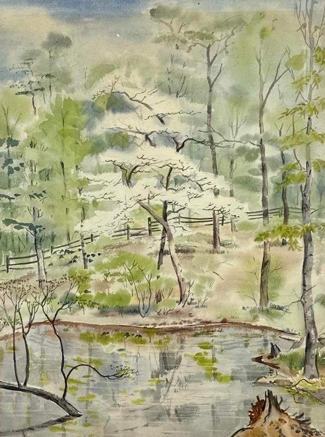 IMPRESSIONIST SPRING LANDSCAPE WATERCOLOR WITH BLOSSOMING TREE: Watercolor painting on paper depicting a serene woodland scene with a white blossoming dogwood or cherry tree overlooking a quiet pond, set in a 29 x 36 inch gold-finished frame. Approximate