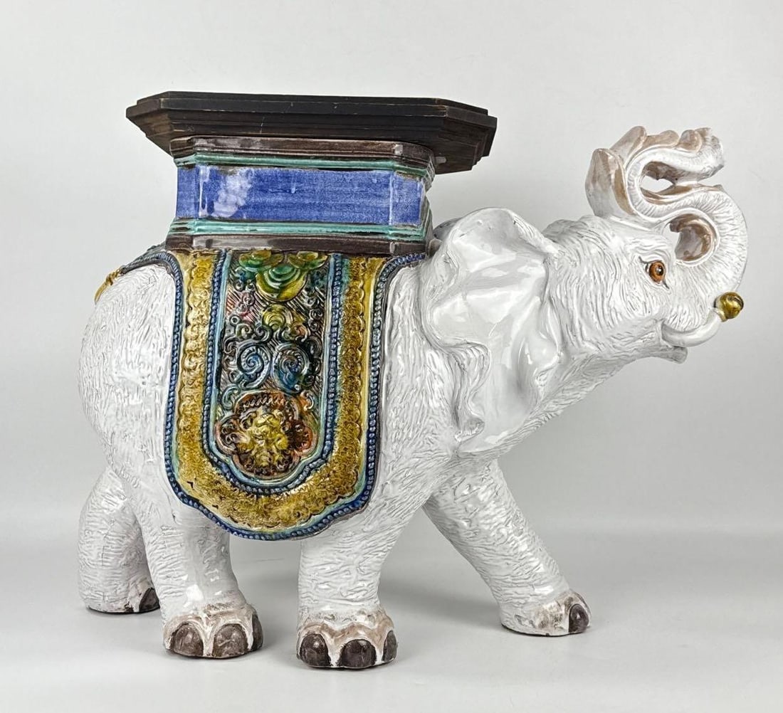VINTAGE CHINOISERIE GLAZED CERAMIC ELEPHANT GARDEN SEAT: A substantial decorative ceramic garden seat or side table. This Chinoiserie-style piece features a stately white elephant with its trunk raised in a gesture of good luck. Approximate Dimensions: