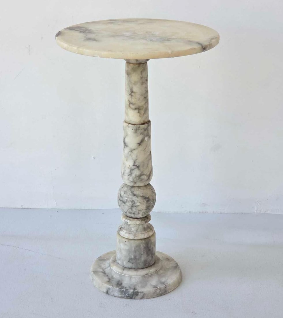 VINTAGE ITALIAN HAND CARVED ALABASTER PEDESTAL STAND BY BRAMBILLA: Carved grey-veined white alabaster pedestal with circular top supported by a turned baluster-form column and stepped base. Approximate Dimensions: 19.25"h x 11.5"dia Artist or Maker: Brambilla