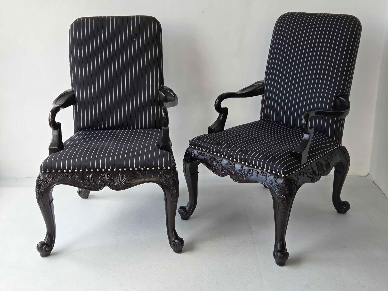 RALPH LAUREN PAIR OF BEL AIR ROCOCO CARVED WOOD BLACK LACQUER UPHOLSTERED ARM CHAIRS (3 of 3): Pair of ebonized mahogany dining arm chairs with elaborate shell and acanthus leaf-carved aprons on cabriole legs upholstered in pinstripe fabric with silver-tone nailhead trim. Approximate Dimensions