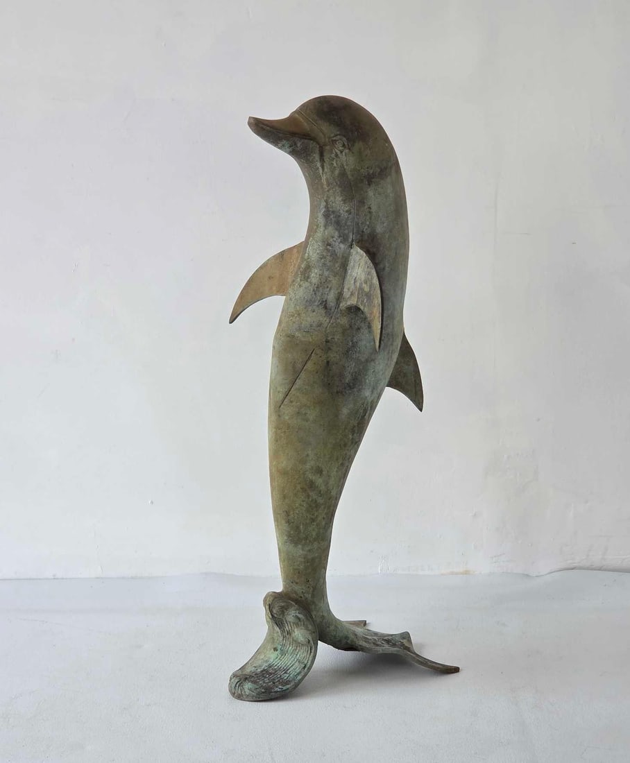 MAITLAND SMITH STYLE VERDIGRIS BRONZE DOLPHIN SCULPTURE: A standing dolphin sculpture executed in verdigris bronze. Approximate Dimensions: 32"H Artist or Maker: Unknown Provenance: From a New York Collector Notes: Although care is taken to p