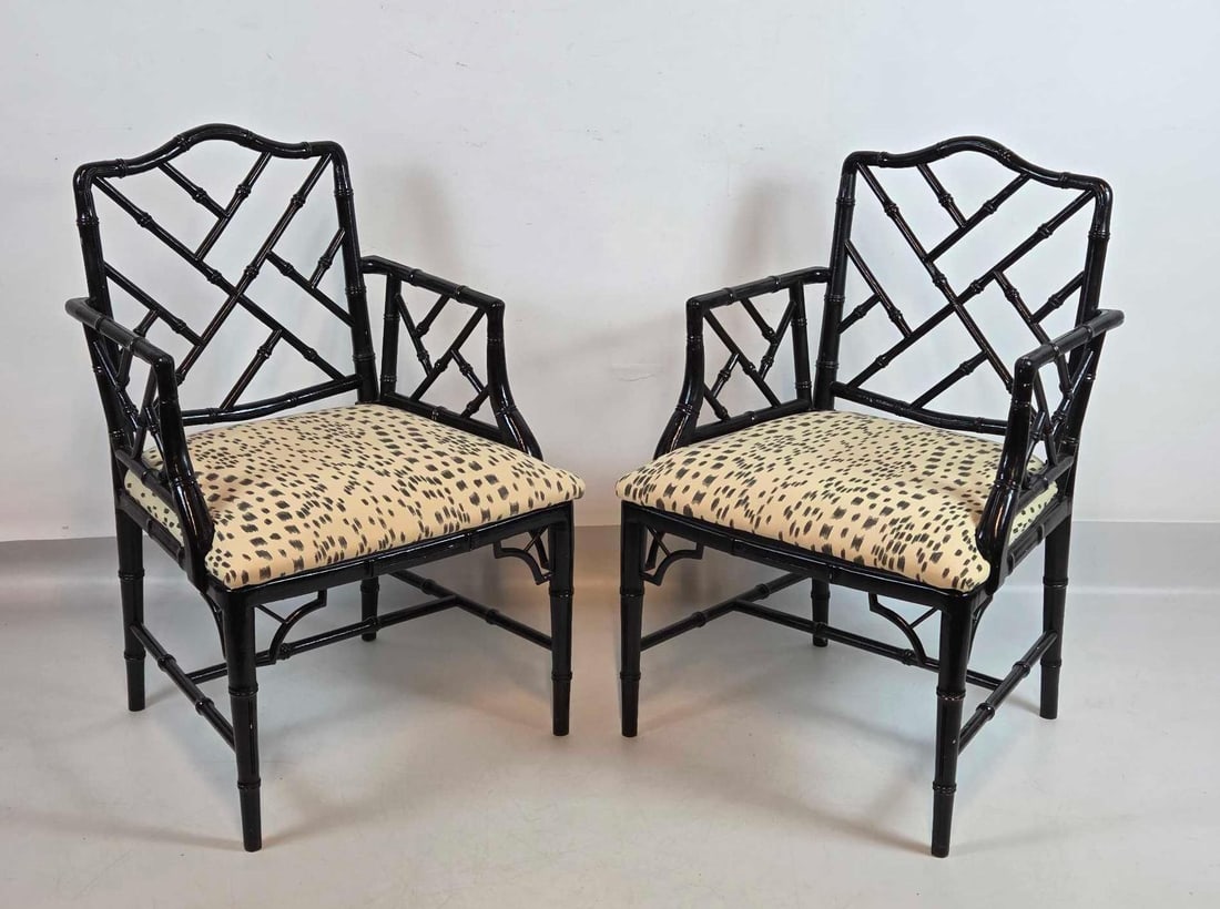 PAIR OF BAKER STYLE BLACK LACQUER CHINESE CHIPPENDALE CHAIRS: A pair of black lacquered faux bamboo chairs with upholstered seats in Brunschwig & Fils Les Touches fabric. Approximate Dimensions:35.75"H x 23.5"W x 20.5"D Artist or Maker: Unknown