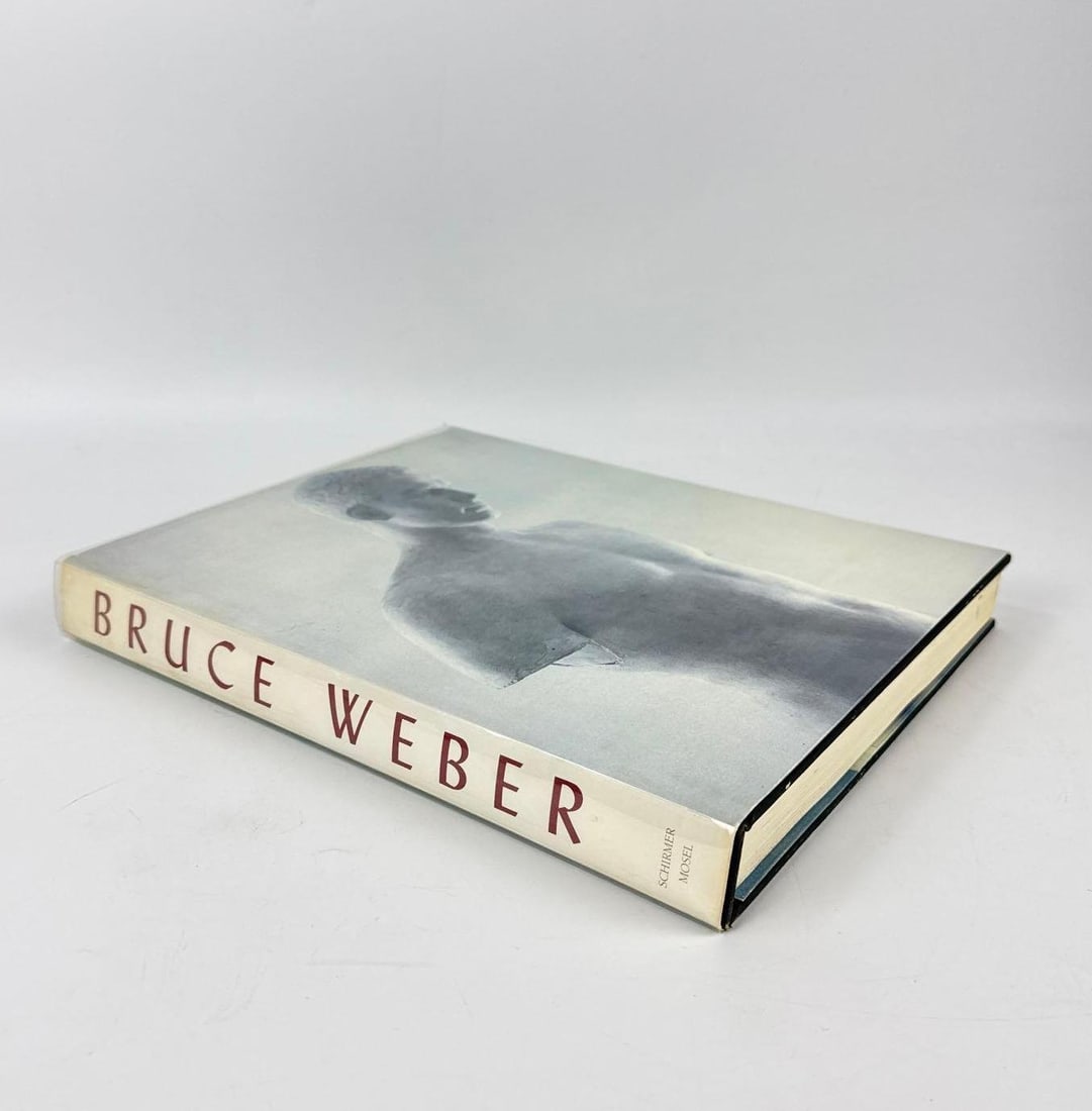 ALFRED A. KNOPF BRUCE WEBER BY BRUCE WEBER HARDCOVER FIRST EDITION: Oversized stated first edition clothbound monograph featuring seminal black-and-white fashion and portrait photography published by Alfred A. Knopf in 1989. Approximate Dimensions: 12.5” X 10&r