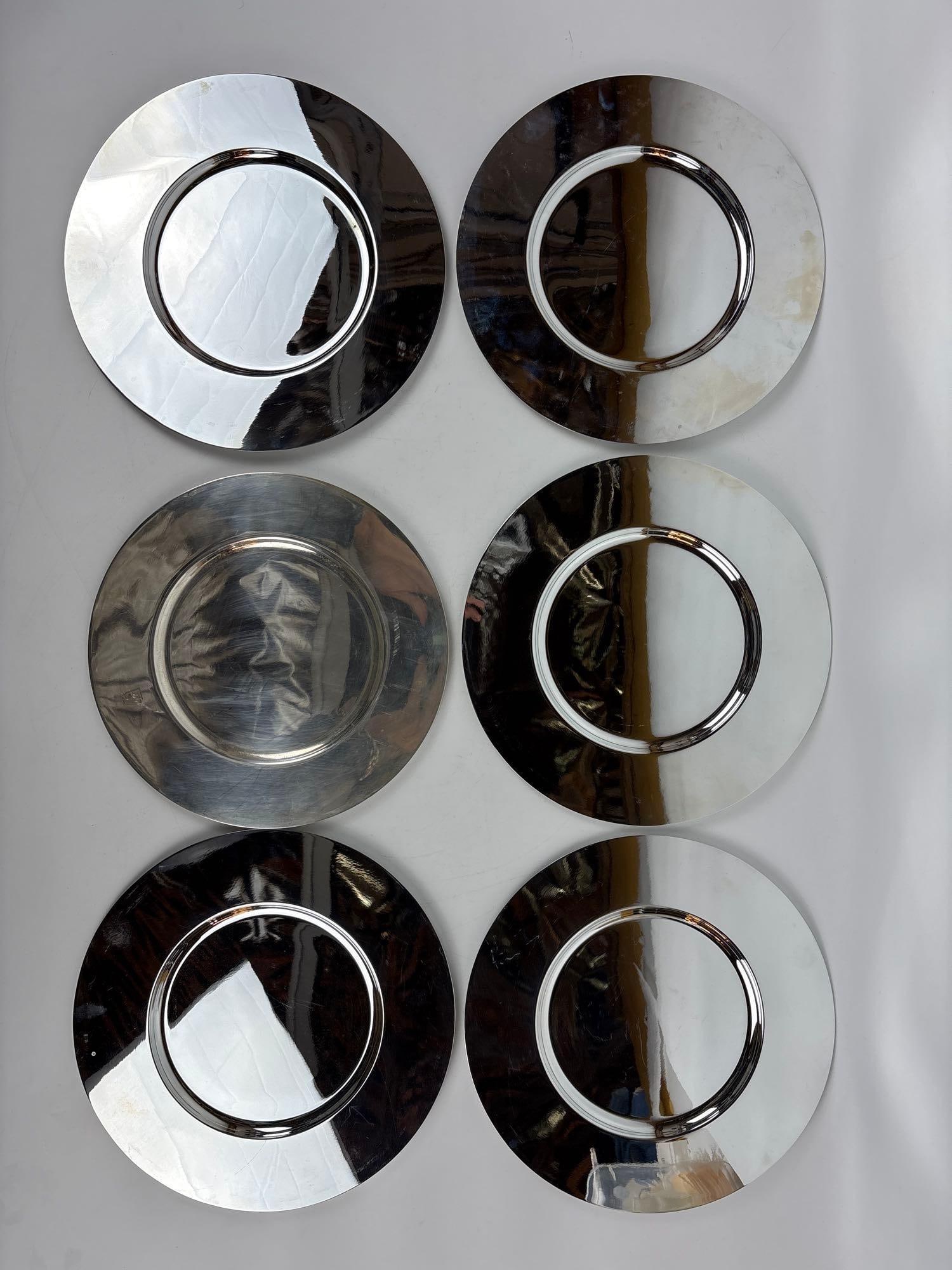 SET OF 6 CHRISTOFLE GALLIA SILVER PLATE CHARGERS: *Set of six Christofle silver-plated service plates from the vintage Gallia collection. 5 are matched, one with engraved "OC" Christofle monogram / logo. Approximate Dimensions: 12" dia 