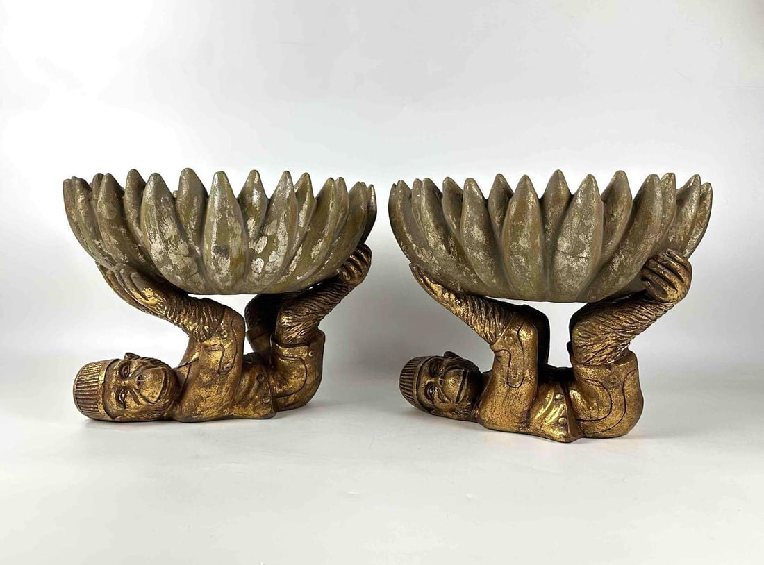 PAIR OF MAITLAND-SMITH STYLE GILT MONKEY AND BANANA LOTUS CENTERPIECES PLANTERS: Two matching planters/centerpieces of reclining monkeys in gold finish supporting large open lotus blossom bowls. Approximate Dimensions: 11"H x 11.75"W x 13.5"D Approximate Total Weight: 23.42