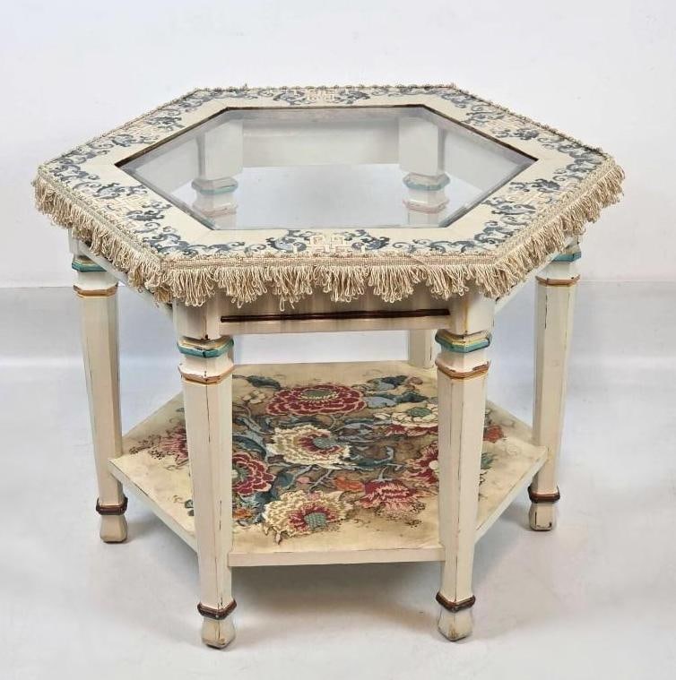 EMBELLISHED HEXAGONAL GLASS TOP TABLE WITH FRINGE: A vintage hand painted 19th Century Aesthetic Movement decorative six sided, two tier occasional wood table with inset glass top, hand-painted floral motifs, and bullion fringe trim in the style of