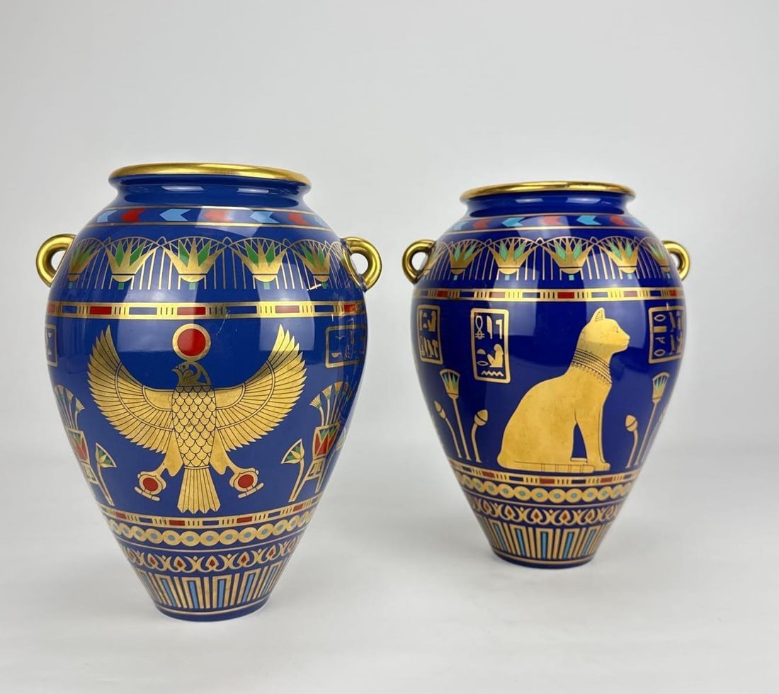 PAIR OF VINTAGE "THE GOLDEN VASE OF BAST" PORCELAIN VASES: A matched pair of fine porcelain decorative vases from the Treasures of Ancient Egypt collection, produced by the Franklin Mint in 1987. These ovoid urns feature a vibrant cobalt blue glaze richly