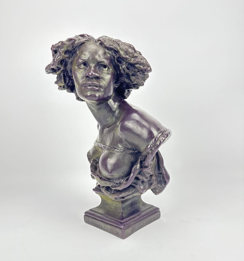 CANDLE BUST AFTER JEAN-BAPTISTE CARPEAUX "POURQUOI NAITRE ESCLAVE": A small-scale, wax candle bust with a patinated bronze look, of the 1868 abolitionist sculpture depicting a bound woman. Approximate Dimensions: 13"H x 8.5"W x 6"D Original Artist: Jean-