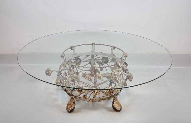 FRENCH PROVENCAL STYLE WROUGHT IRON FLORAL COFFEE TABLE: Vintage circular garden or sunroom cocktail table with a hand-wrought iron base featuring dimensional climbing roses and leaves under a glass top Approximate Dimensions: 14.5"h x 41.5"dia (ta