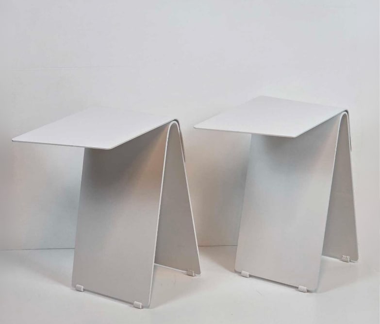 ERIC PFEIFFER FOR PETER PEPPER PAIR OF "HANGOVER" WHITE BENT STEEL SIDE TABLES: Pair of minimalist white powder-coated steel cantilevered accent side tables. Approximate Dimensions: 22"H x 18"W x 12"D Artist or Maker: Eric Pfeiffer for Peter Pepper Provenance: From