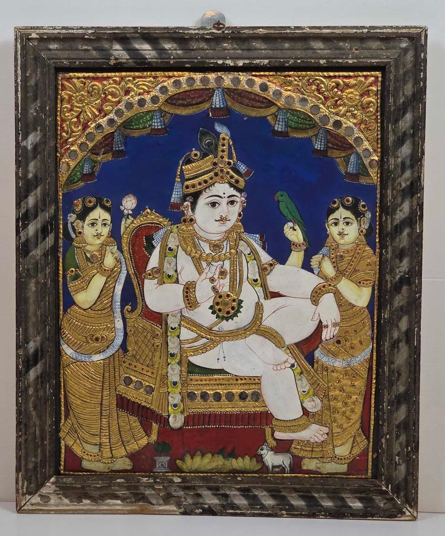 ANTIQUE INDIAN TANJORE PAINTING OF BALA KRISHNA WITH SEMI-PRECIOUS STONES AND GOLD LEAF: Traditional Thanjavur (Tanjore) school painting on wooden panel. Approximate Dimensions: 20" X 16" ; FRAME 23" X 19" Artist or Maker: Unknown Provenance: From a New York Coll