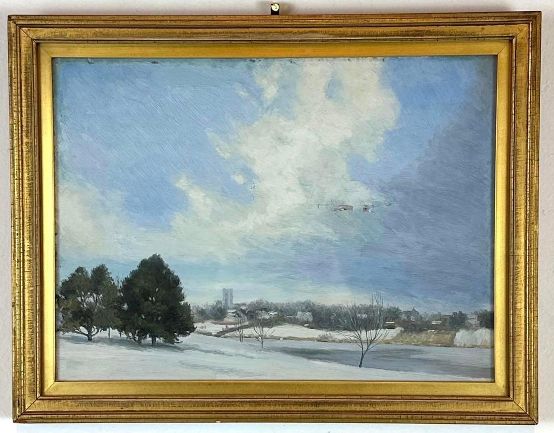 20TH CENTURY WINTER LANDSCAPE OIL PAINTING: Atmospheric oil on board depicting a snowy river valley with distant architecture and evergreen trees under a dramatic sky, housed in a giltwood frame. Approximate Dimensions: 12”x 15” Fra