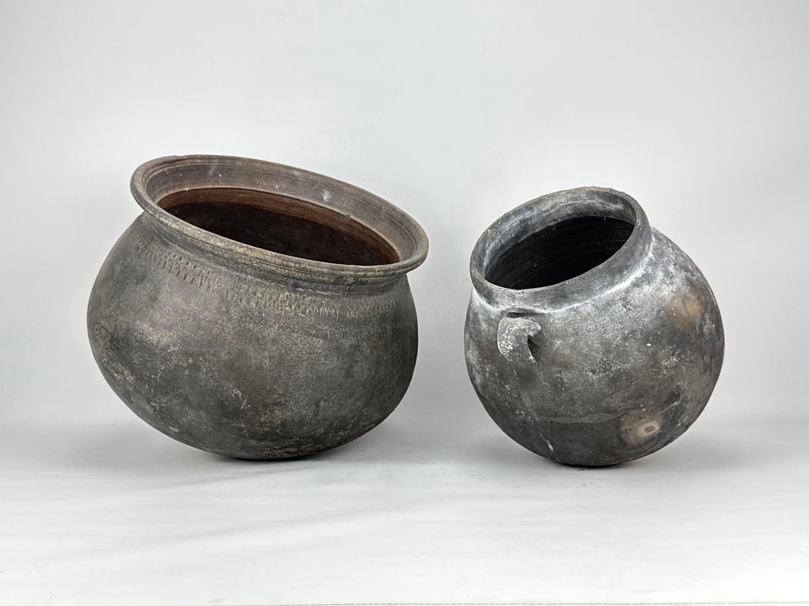 TWO LARGE RUSTIC HAND-THROWN BLACK CLAY CAULDRON VESSELS (1 of 17)