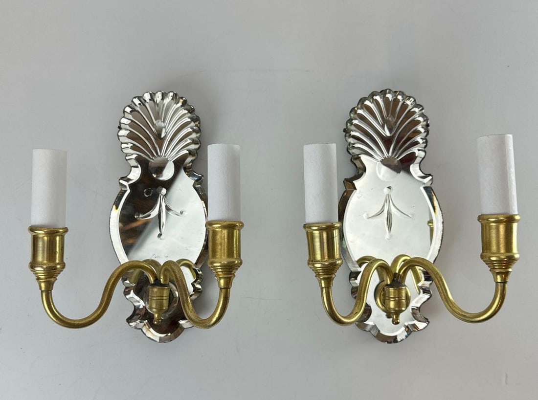 PAIR OF C. 1920 VENETIAN STYLE ETCHED MIRROR BACK SCONCES (GOLD FINISH): Set of two antique brass-finished wall lights with scalloped glass backplates and double scrolling candle arms. Approximate dimensions: 9” x 7” x 5” Artist or Maker: Unknown Pr