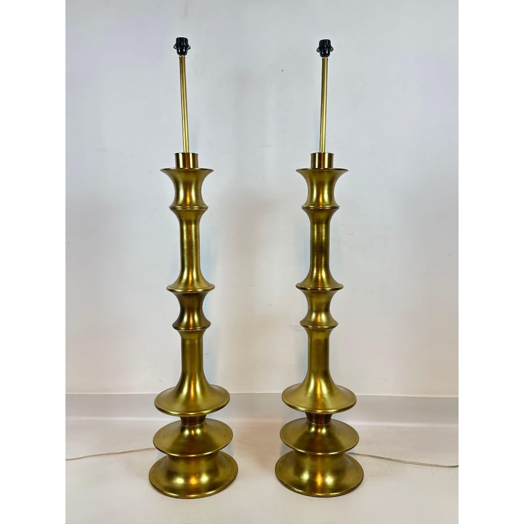 PAIR OF ARTERIORS MONUMENTAL BRASS FINISH TIERED SPINDLE FLOOR LAMPS: Set of two contemporary tall floor lamps with sculptural multi-tiered bases and antique brass finish. Approximate dimensions: 59” x 14”diameter Artist or Maker: Unknown Provenance: F