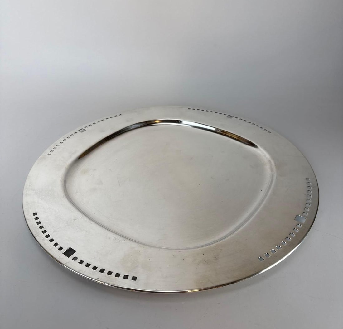 RICHARD MEIER SILVER PLATED "SKYSCRAPER" TRAY BY SWID POWELL: Large circular Postmodernist platter made in Italy with signature geometric pierced gallery rim measuring 15 inches in diameter Approximate Dimensions: 15" DIA Artist or Maker: Swid Powell