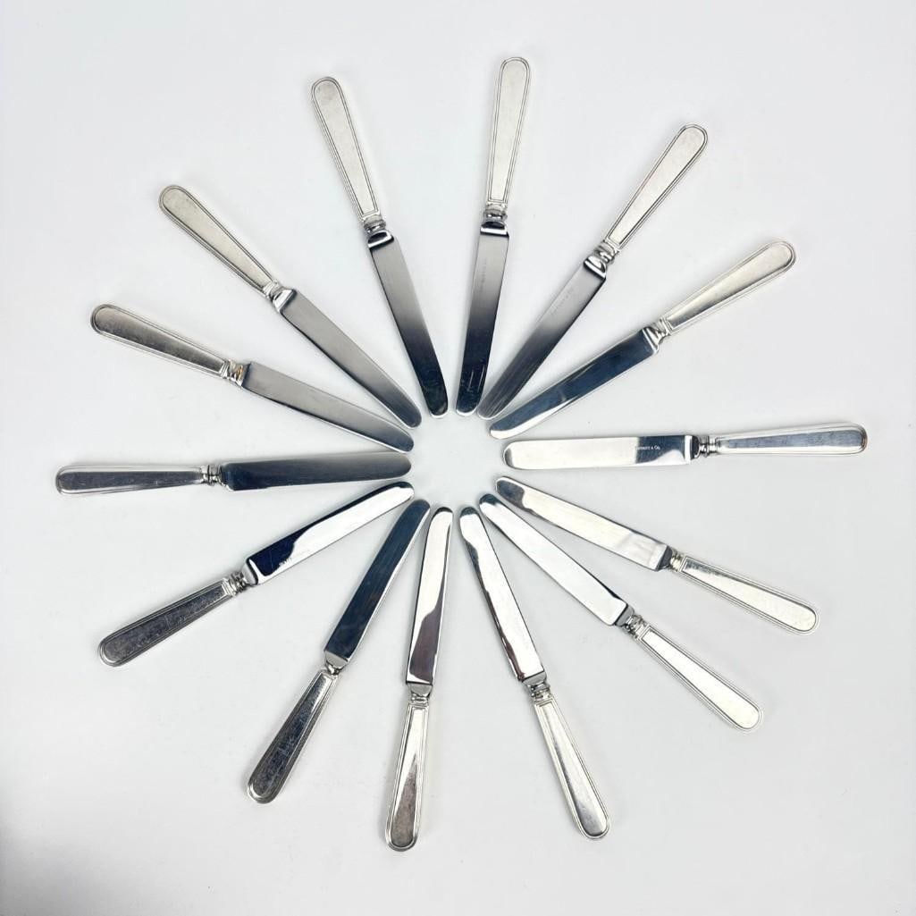 TIFFANY AND CO. STERLING SILVER HAMILTON GRAMERCY 7 3/8" KNIFE SET (14): 7 3/8” Knife x 14; two versions, see photos. Total Gross Weight: 23.05 Approximate Dimensions: Artist or Maker: Tiffany and Co. Provenance: From a New York Collector