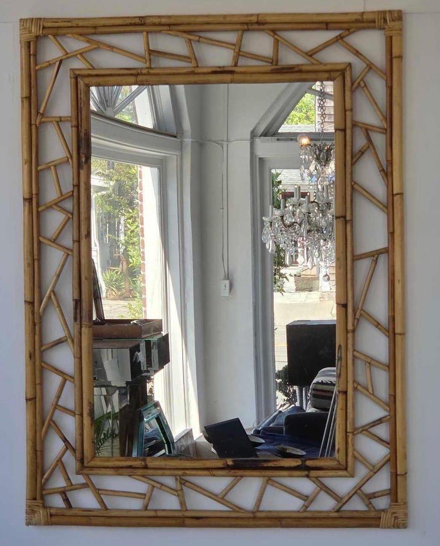 VINTAGE LARGE RATTAN FRETWORK WALL MIRROR: A substantial mid-century modern rectangular wall mirror featuring a natural rattan frame with an intricate geometric fretwork border. Approximate Dimensions: 48"h x 36"w Artist or Maker: Unkn