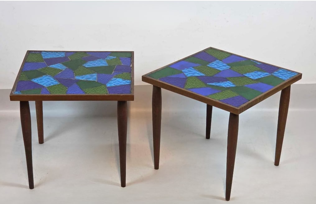 PAIR OF MID-CENTURY MODERN JON MATIN STAINED GLASS MOSAIC SIDE TABLES: Hand-cut geometric cobalt and emerald glass tile tops on tapered walnut legs. Approximate Dimensions: 15" high x 16" wide x 16" deep. Artist or Maker: Jon Matin Provenance: From a New York