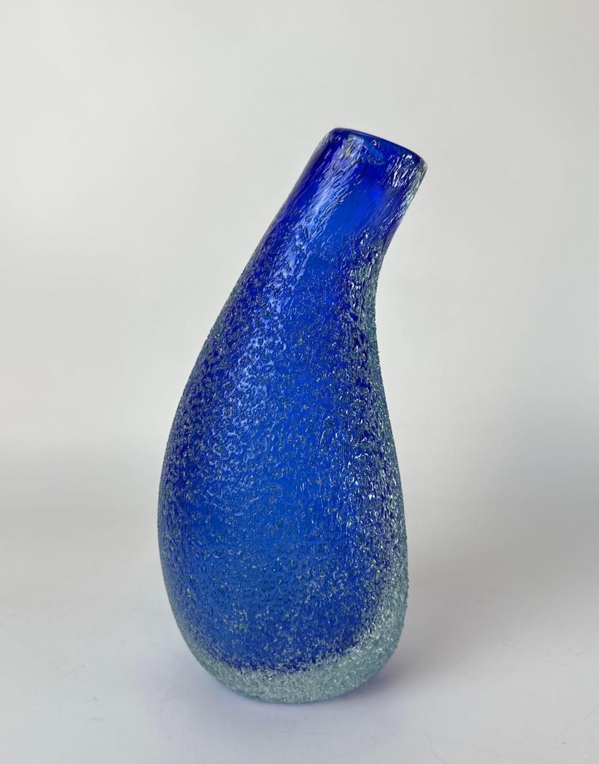 VINTAGE FACETED SOMMERSO GLASS VASE BY ALESSANDRO MANDRUZZATO: Italian Murano art glass vase with a multi-faceted geometric exterior featuring a deep blue and yellow sommerso core encased in thick clear glass. Approximate Dimensions: 8.75”L x 4.25”W x