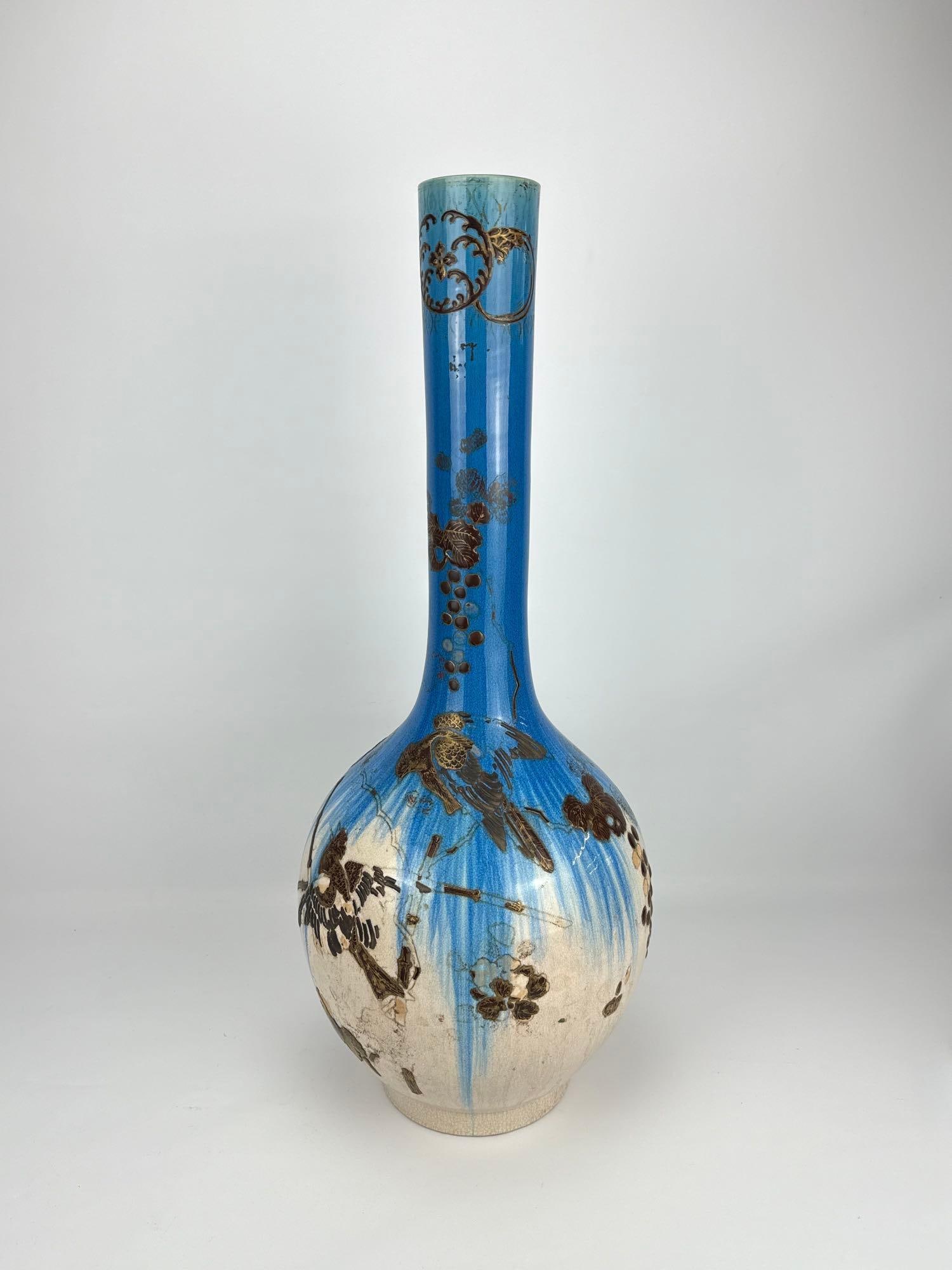 MONUMENTAL JAPANESE TURQUOISE DRIP GLAZE LONG NECK FLOOR VASE: Large-scale ceramic vessel featuring a vibrant turquoise flambé drip over a cream crackle ground with high-relief molded avian and floral branch decoration Approximate Dimensions: 32.5”h x 16&r