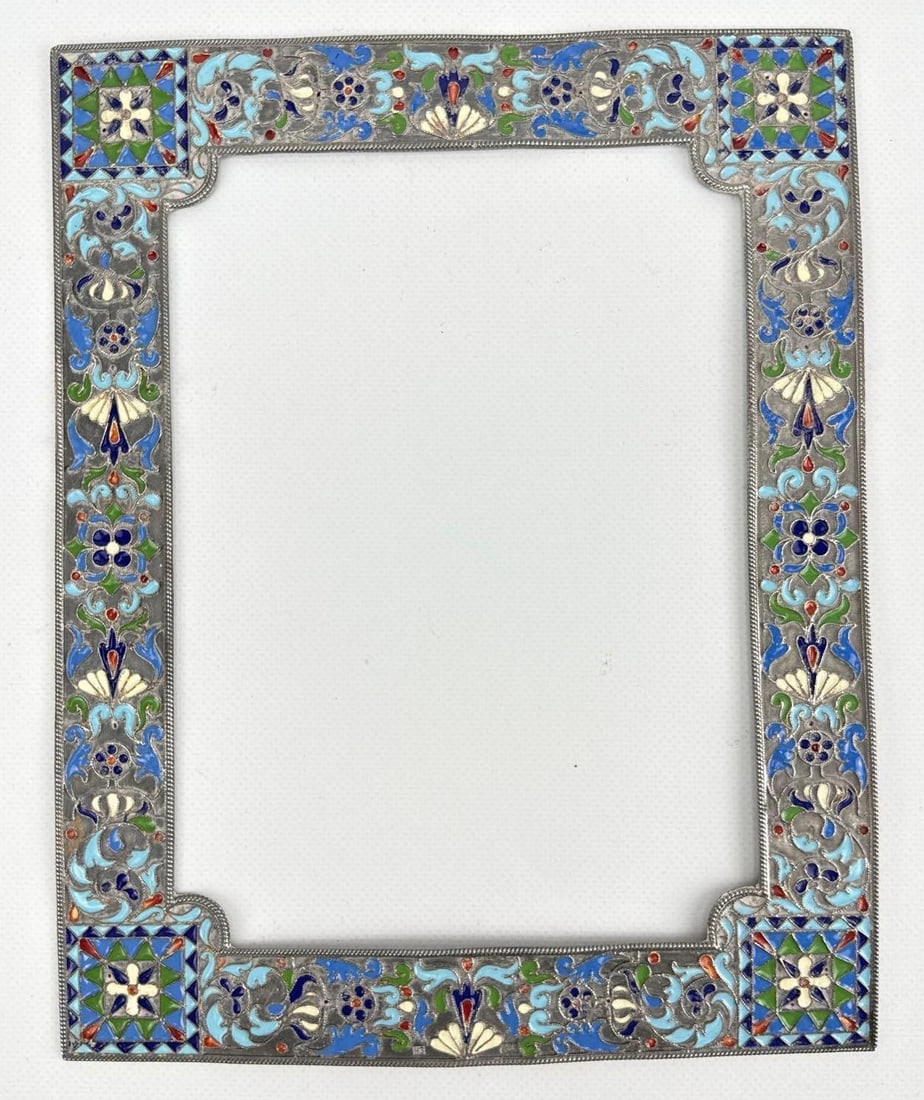 ANTIQUE RUSSIAN SILVER CLOISONNE ENAMEL PICTURE FRAME FRONT: Ornate gilt silver rectangular frame face featuring polychrome floral and scrolling filigree enamel work. Approximate Dimensions: 8.75” x 7” approx weight: 3.665 ozt Artist or Maker: U