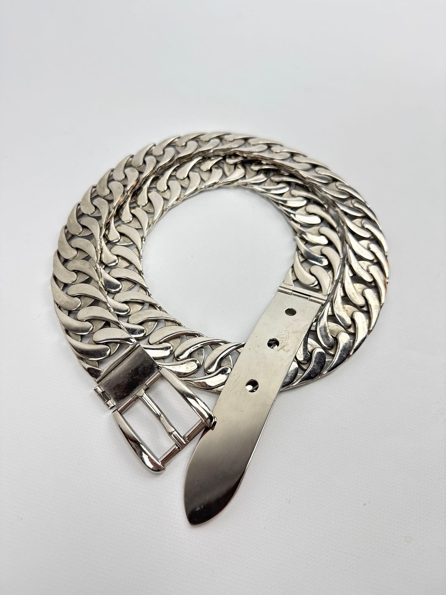 GUCCI ITALY SILVER-PLATED CURB LINK BELT: *Vintage designer accessory featuring a heavy-gauge polished curb link chain and a classic rectangular buckle with a smooth metal tip Approximate Dimensions: 38”L Artist or Maker: Unknown
