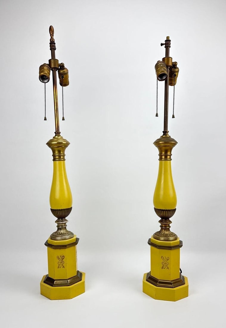 FREDERICK COOPER STYLE PAIR YELLOW HOLLYWOOD REGENCY NEOCLASSICAL TABLE LAMPS: Pair of mid-century neoclassical style table lamps in vibrant yellow finish with brass accents, urn-form bodies, and octagonal pedestals decorated with gilt ribbon and torch motifs. Approximate Dimens