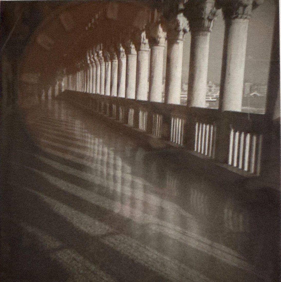 VENICE DOGE'S PALACE COLONNADE SILVER GELATIN PRINT: Square-format black and white silver gelatin photograph depicting the rhythmic columns and high-contrast shadows of the Palazzo Ducale colonnade in Venice, Italy. (Note: Image is loose in frame) Appro
