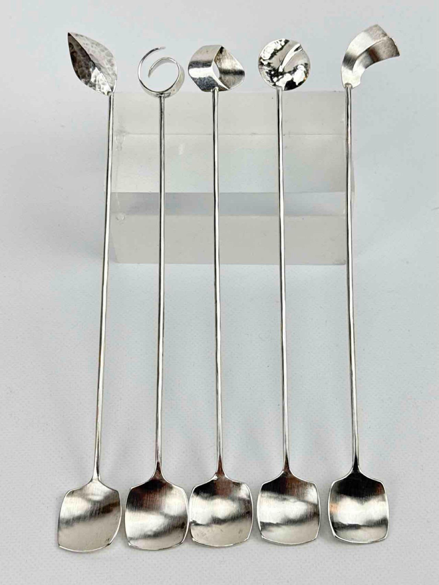 SET OF 5 ODELL STERLING SILVER MODERNIST COCKTAIL STIRRERS: Five handcrafted sterling silver bar spoons with unique geometric and organic finials and hammered details. Approximate Dimensions: 8” X 1” Approximate Weight: 2.585 ozt Maker: Odell Prove