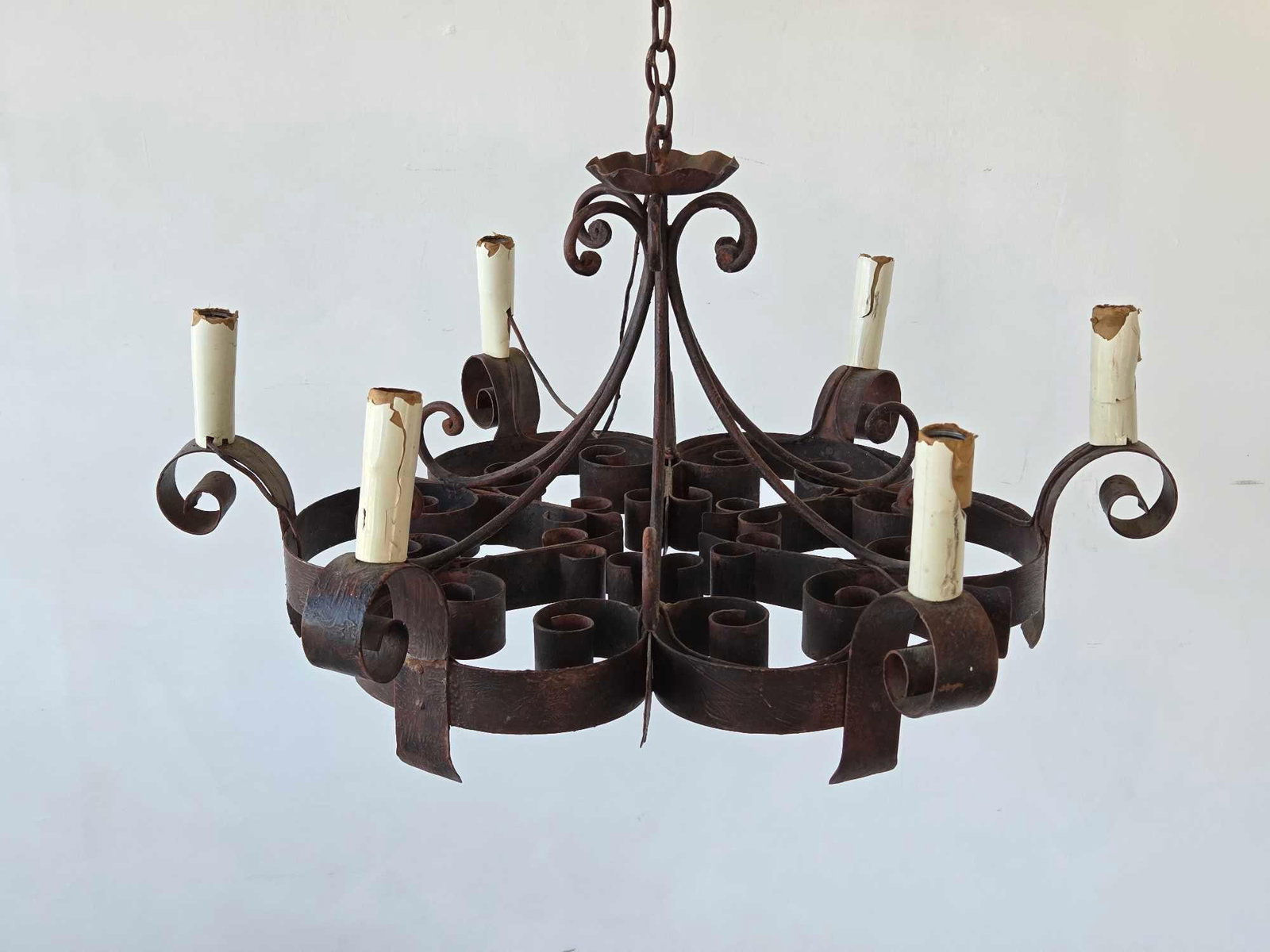 VINTAGE ARTE DE MEXICO STYLE SPANISH REVIVAL WROUGHT IRON 6-LIGHT CHANDELIER: Hand-forged wrought iron circular frame with six candelabra sockets and classic scrollwork ornamentation Approximate Dimensions:14"h x 28"dia Artist or Maker: Unknown <