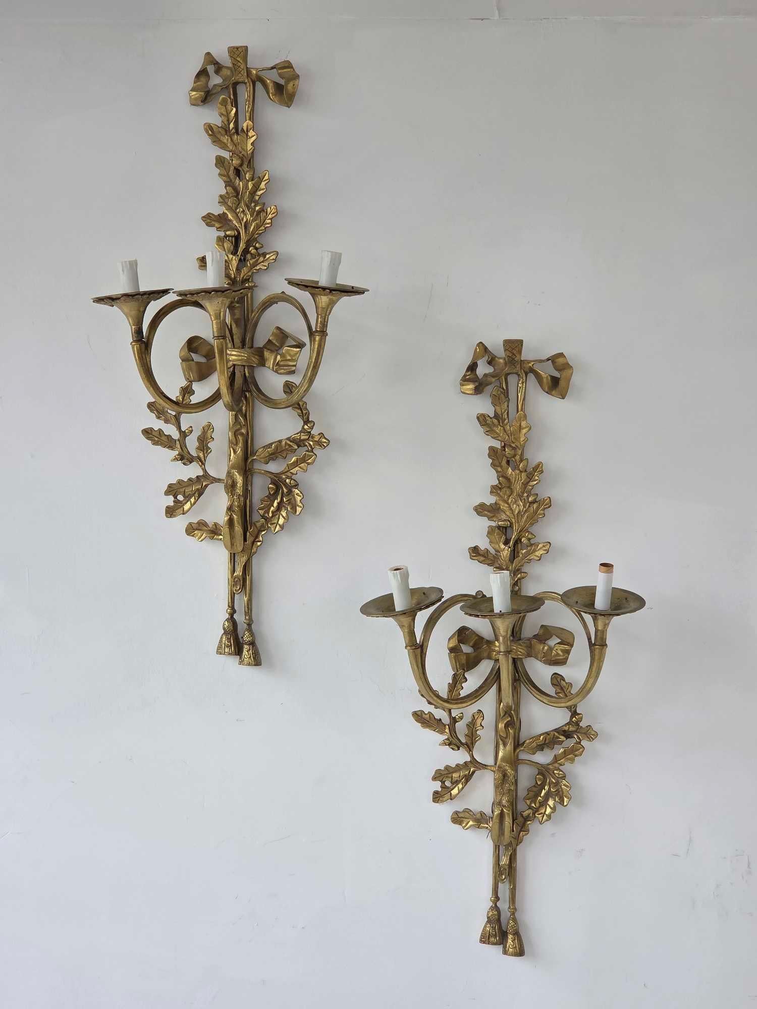 FINE PAIR OF ANTIQUE ENGLISH REGENCY HUNTING HORN MOUNTED SCONCES: Three-light wall fixtures designed as coiled hunting horns. Approximate Dimensions: 35.5"h x 16"w x 9.75"d Artist or Maker: Unknown Provenance: From