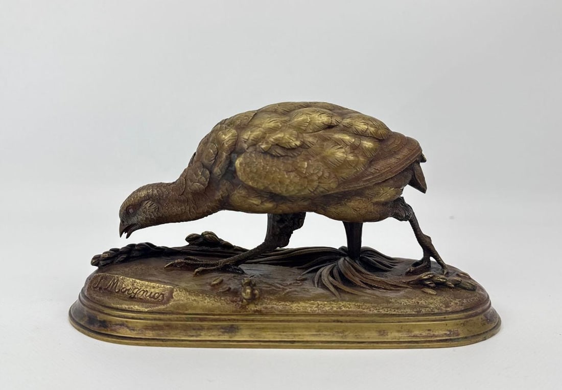 JULES MOIGNIEZ (FRENCH, 1835-1894) ANTIQUE ANIMALIER BRONZE OF A GAME BIRD: A signed 19th-century French patinated bronze study of a game bird foraging on a naturalistic earthen base, featuring the characteristic high-detail casting and rich brown patina associated with the M