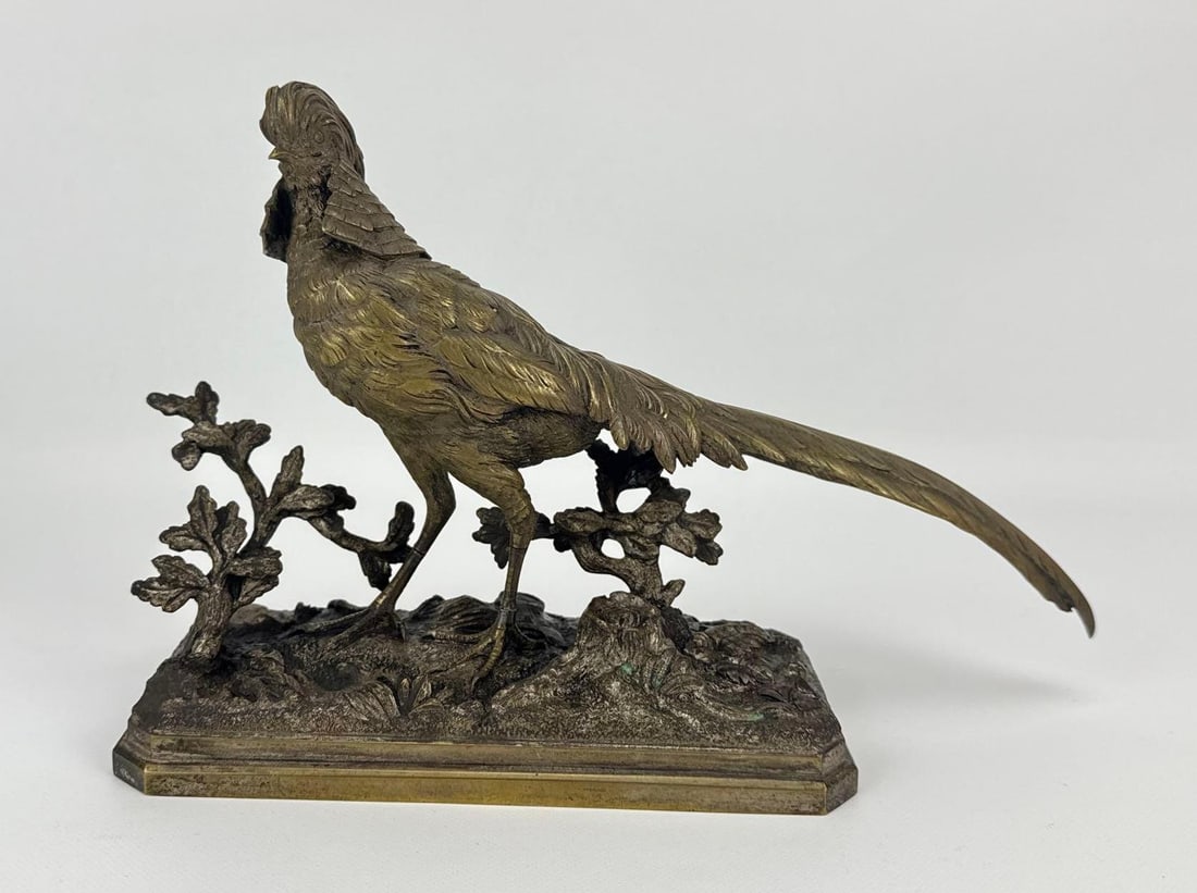 HENRI TRODOUX (FRENCH, 1815-1881) ANTIQUE BRONZE SCULPTURE OF A PHEASANT: Naturalistic 19th-century patinated bronze animalier study of a pheasant standing on a rocky, leaf-strewn oval base, signed in the casting. Approximate Dimensions: 7.5”h x 11.75”w x 3.5&rd